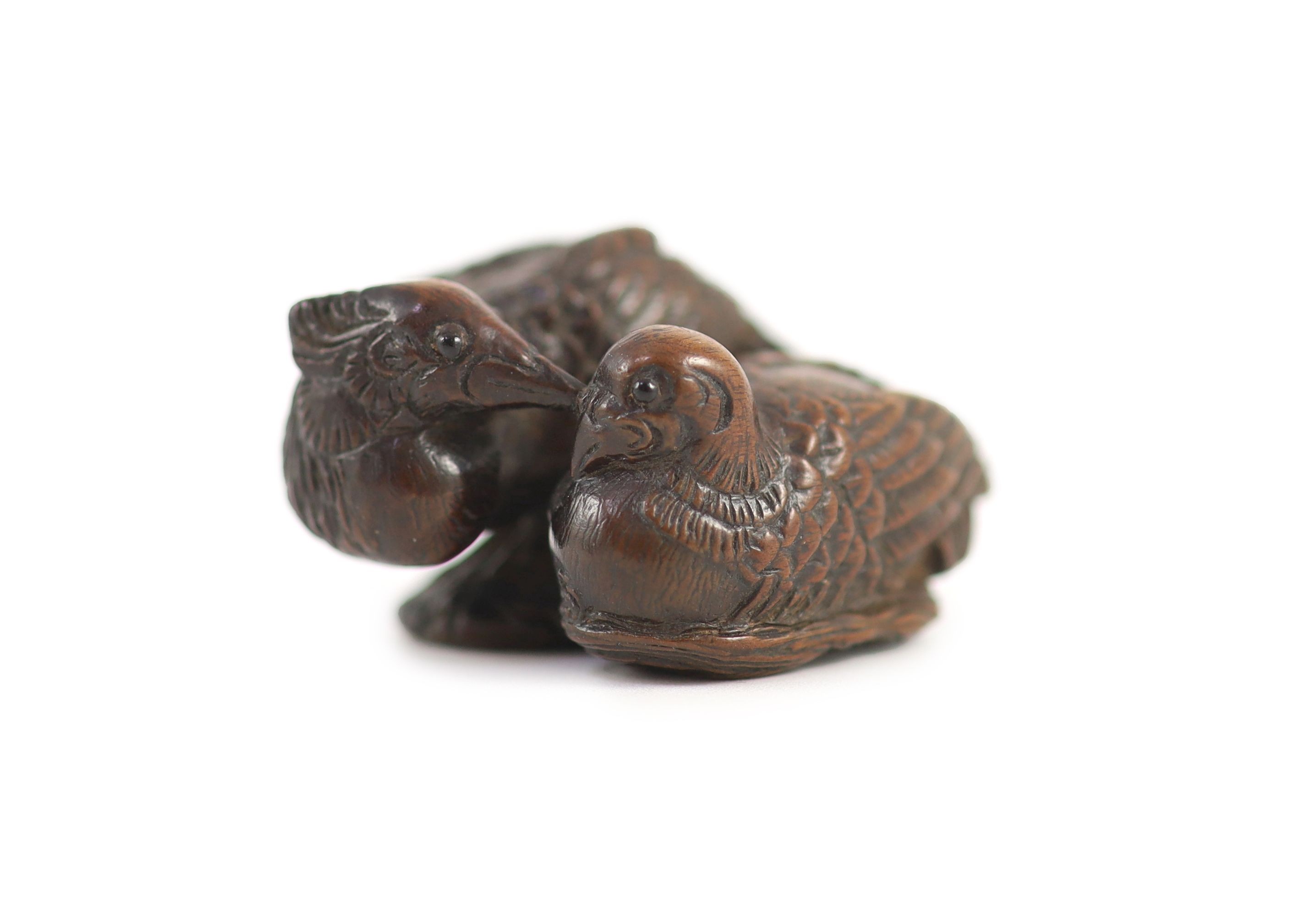 A Japanese wood netsuke of a male and female mandarin duck (oshidori), School of Yamaguchi Okatomo, 19th century, 4cm long